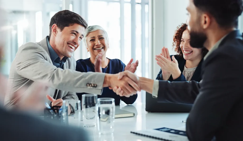 Happy, businessmen handshake for partnership, agreement or good deal at conference.