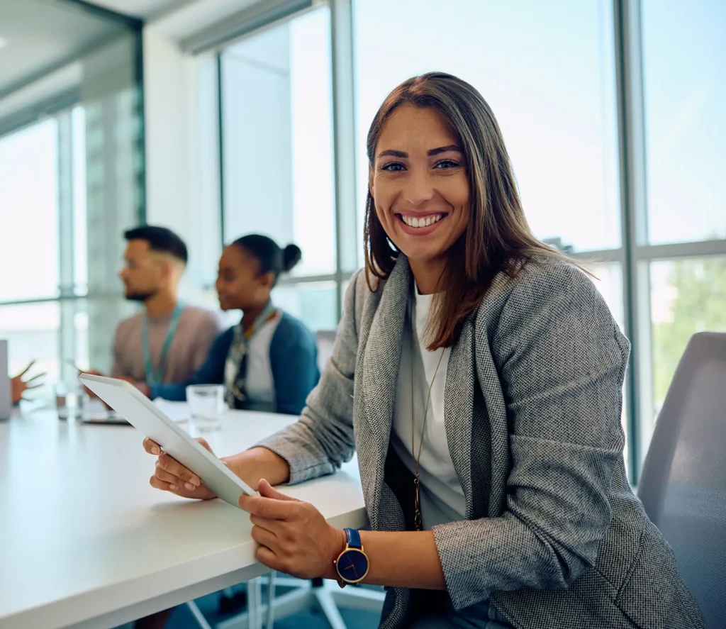 happy businesswoman using touchpad